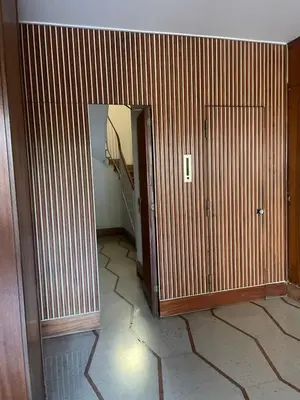 a room with a hallway with a mirror and a staircase at Bilocale Socrates in Rome