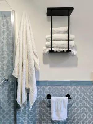 a bathroom with white towels and a shower at A casa di Piero in Rome
