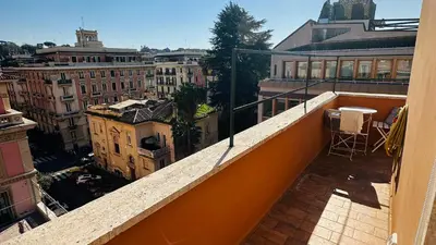 a balcony with a view of a city at Terrazza Urania - Penthouse terrace with 360 view of Rome in Rome
