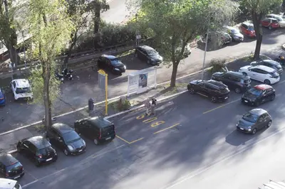 a group of cars parked in a parking lot at Marisa lovely house in Rome