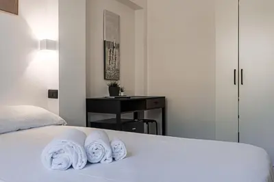 a bedroom with a bed with towels on it at Vatican Vista Apartment in Rome