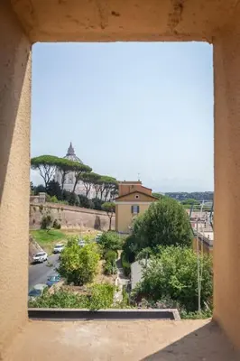 a view of a city from a window at Vatican Vista Apartment in Rome