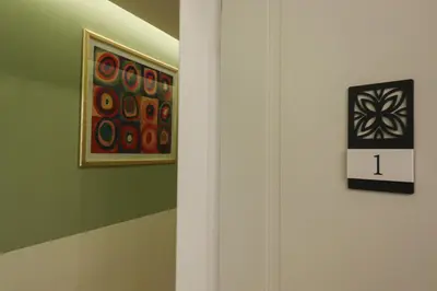 a room with a painting on the wall and a lightswitch at Re Di Rhome Guest House in Rome