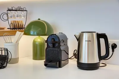 a toaster and a coffee maker on a counter at Green Tevere Rooftop in Rome