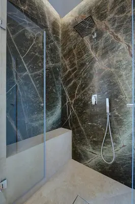 a shower with a glass door in a bathroom at Green Tevere Rooftop in Rome