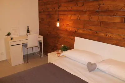 a bedroom with a bed and a desk with a desk at B&B Girovagando in Rome