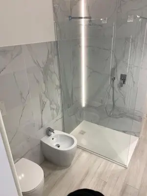 a bathroom with a shower and a toilet and a sink at CasaFaleria in Rome