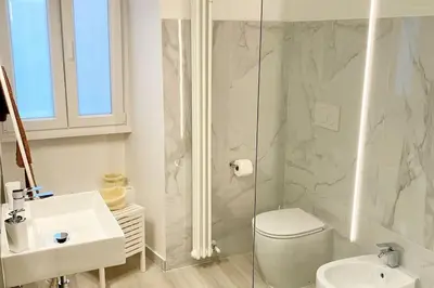 a bathroom with a toilet and a sink and a shower at CasaFaleria in Rome