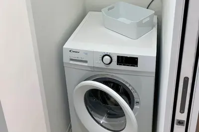 a washing machine with a box on top of it at CasaFaleria in Rome