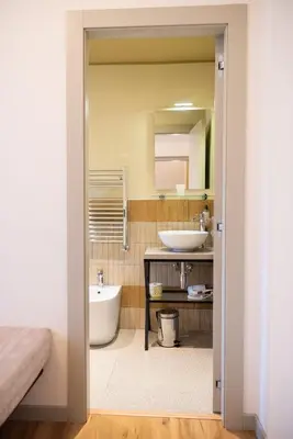 a bathroom with a tub and a sink and a mirror at Residenza Leone XIII in Rome
