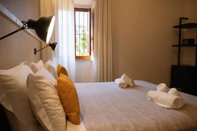 a bedroom with a bed with towels on it at Residenza Leone XIII in Rome