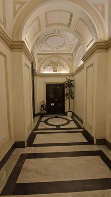 an empty room with a large room with a ceiling at Luxury Apartment delle Fratte in Rome