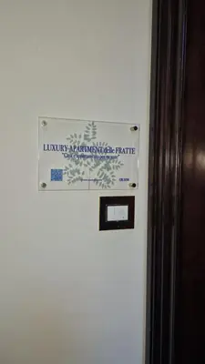 a sign is on the side of a refrigerator at Luxury Apartment delle Fratte in Rome