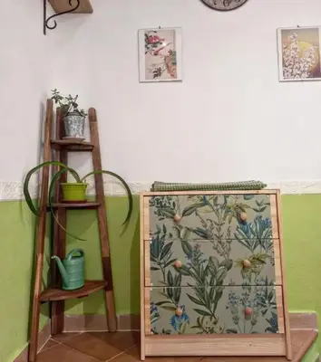 a cabinet with a floral pattern on it in a room at Green House Roma in Rome