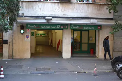 a man walking in front of a building at La Casa di Fabio in Rome