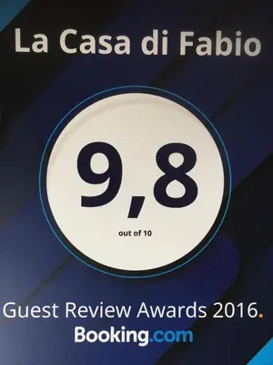 a sign that reads quest review awards booksigning at La Casa di Fabio in Rome