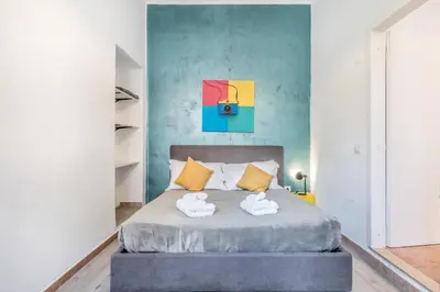a bedroom with a bed with two towels at La Casetta Trastevere in Rome