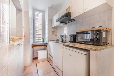 a kitchen with a counter top with a microwave at La Casetta Trastevere in Rome