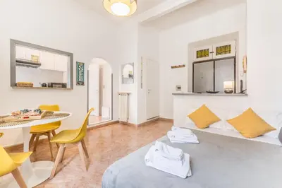 a living room with a couch and a table at La Casetta Trastevere in Rome