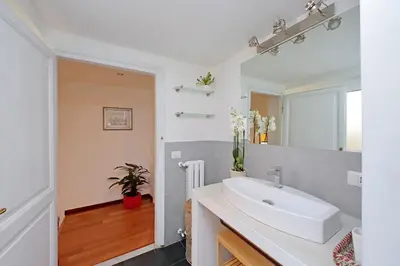 a bathroom with a sink and a mirror at Casa Giubbonari con terrazzo in Rome