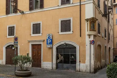 a building with a parking sign in front of it at Dimora Capo di Ferro in Rome