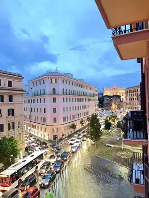 a city with cars parked in a parking lot at The house Of Brindisi in Rome