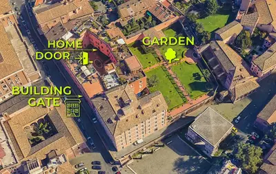 an overhead view of a city with buildings and a building gate at Exclusive retreat between history and comfort in Rome