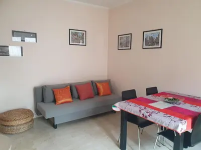a living room with a couch and a table at Laura's RHome in Rome