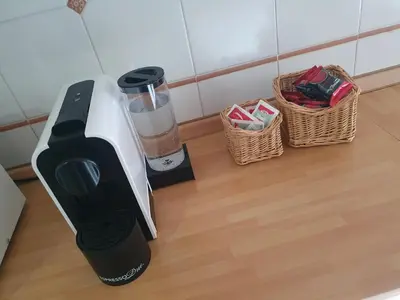 a blender sitting on a counter with two baskets at Laura's RHome in Rome
