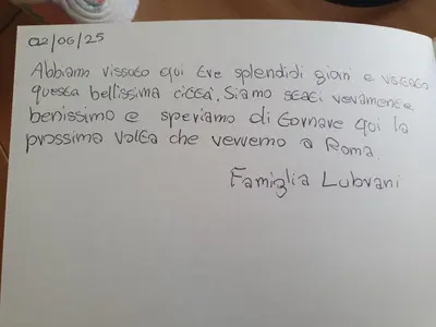 a white piece of paper with writing on it at Laura's RHome in Rome