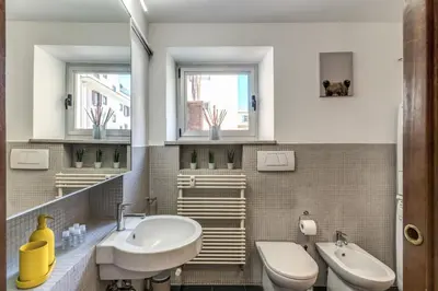 a bathroom with a sink and a toilet at Oasis Apartment Trastevere in Rome