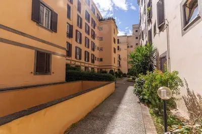 an alleyway between buildings in an apartment complex at Oasis Apartment Trastevere in Rome