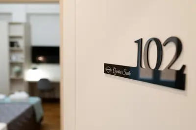 a sign on the door of a living room at Querini Suite Roma in Rome