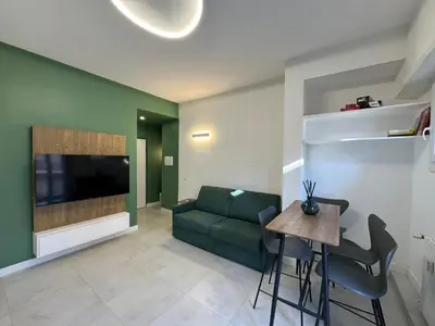 a living room with a couch and a table at Numiro in Rome