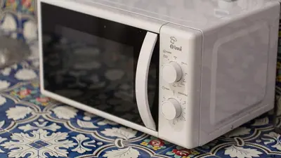 a microwave oven sitting on top of a table at Scala Studio by Rental in Rome in Rome