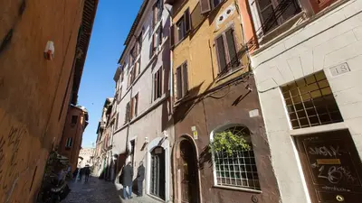 a group of people walking down a street at Scala Studio by Rental in Rome in Rome