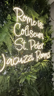 a sign that says rome is a garden st peter extra rooms at Jacuzzi Rooms Vatican Museum in Rome