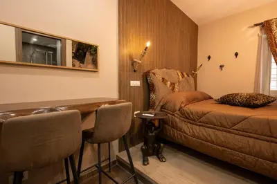 a room with a couch and a table and chairs at Jacuzzi Rooms Vatican Museum in Rome