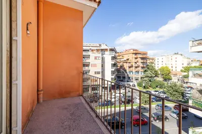 a balcony with a view of a parking lot at Casa MARIA, casa vacanze Aurelio in Rome