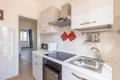 a kitchen with a sink and a microwave at Casa MARIA, casa vacanze Aurelio in Rome