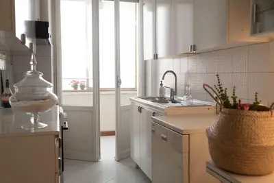 a kitchen with a sink and a counter top at Tiziano apartment-a spacious home for you in Rome in Rome