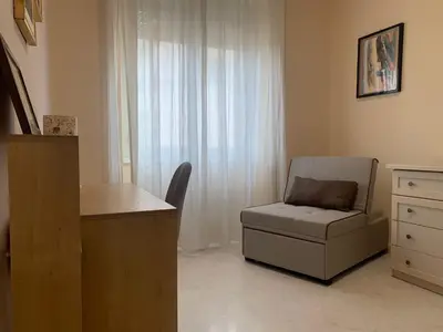 a room with a desk and a chair and a desk and a window at Tiziano apartment-a spacious home for you in Rome in Rome