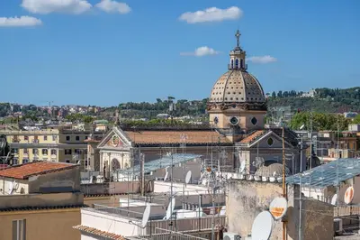a view of a city with a domed building at Colonna Inn in Rome