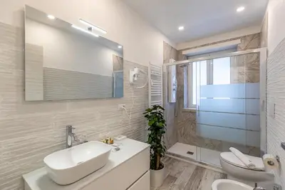 a living room with a couch and a table at Gregorio VII Luxury Home Apartment in Rome