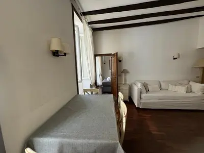 a living room with a bed and a couch at Suite Colonna in Balestrari in Rome