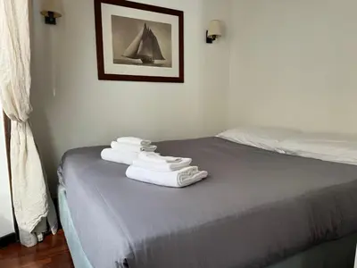a bedroom with a bed with towels on it at Suite Colonna in Balestrari in Rome