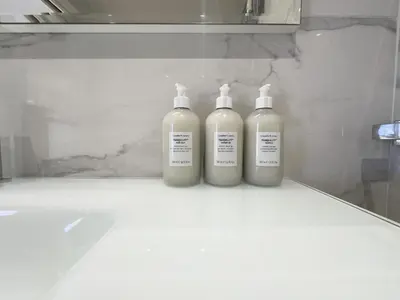 two bottles of lotion sitting on a counter in a bathroom at Caffarella Park Terraced 2BR Apartment in Rome