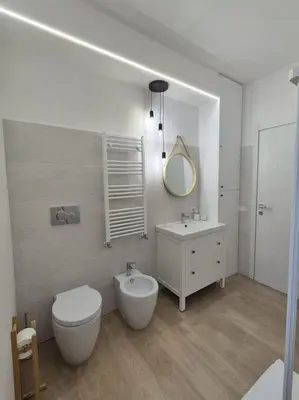 a bathroom with a toilet and a sink and a mirror at Al Fontanile in Rome