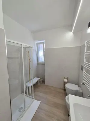 a bathroom with a shower and a toilet and a sink at Al Fontanile in Rome