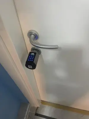 a remote control hanging on the wall of a room at Parenti B&B in Rome
